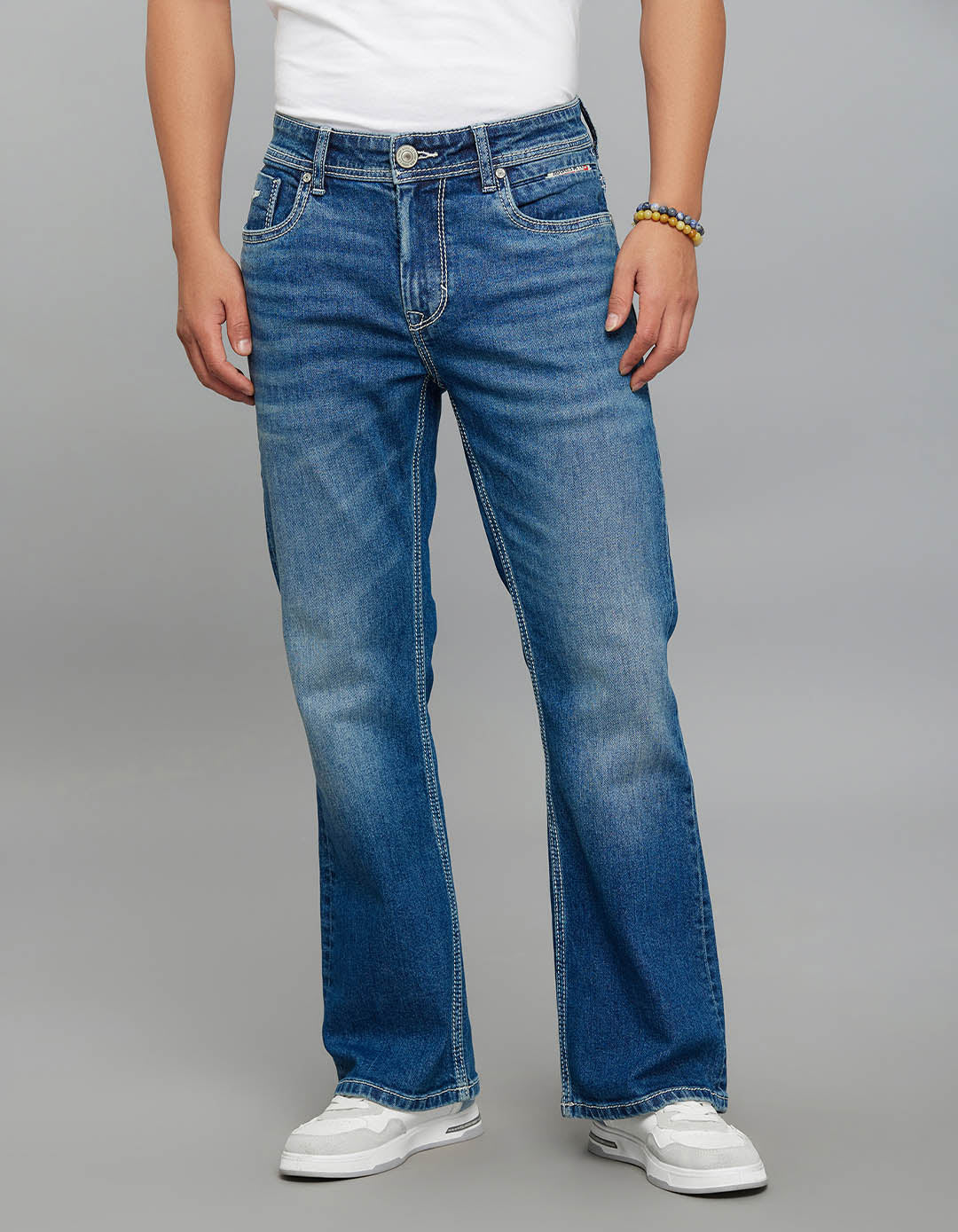 Med Blue Mid Rise Cropped Length Loose Boot Leg Stretch Jeans